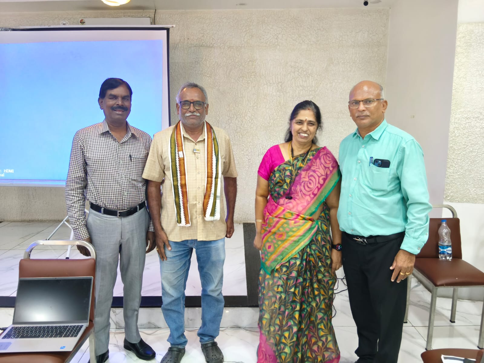 Advisor Krishnan with colleagues at an LIC event